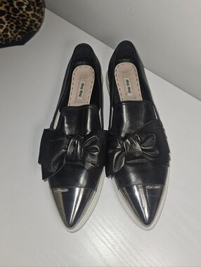 Miu Miu Black Leather Bow Loafers with Metallic Silver Pointed Toe